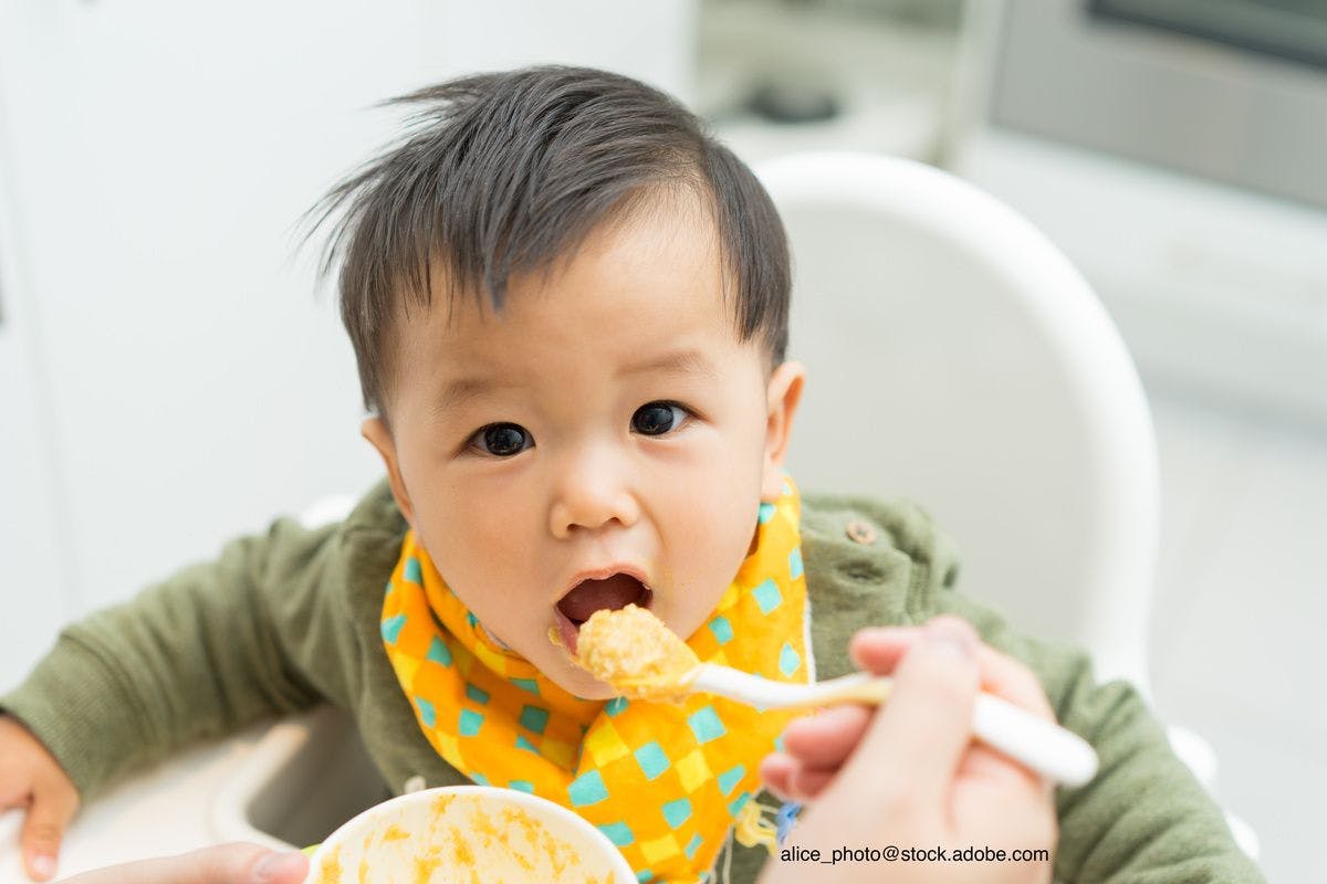 child being fed