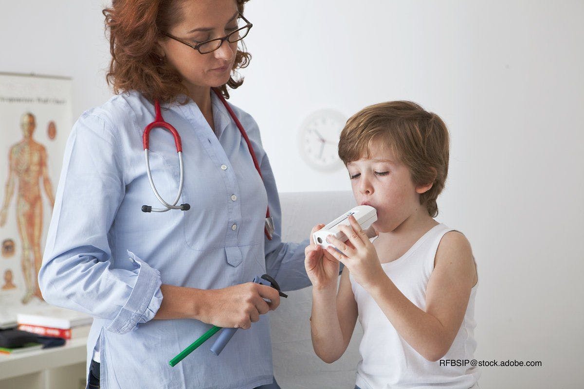 doctor performing breathing test on child
