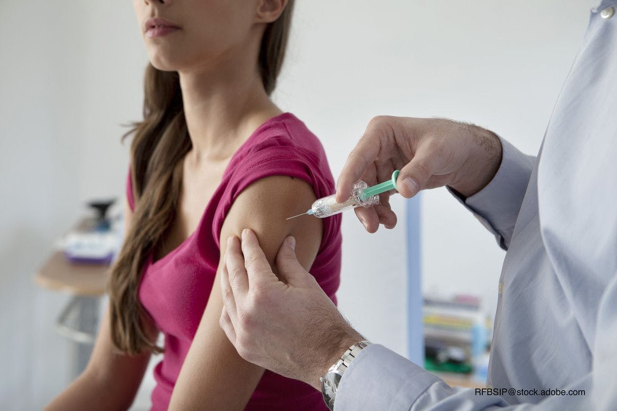 teen girl getting a vaccine