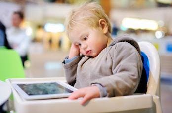 child looking at a screen