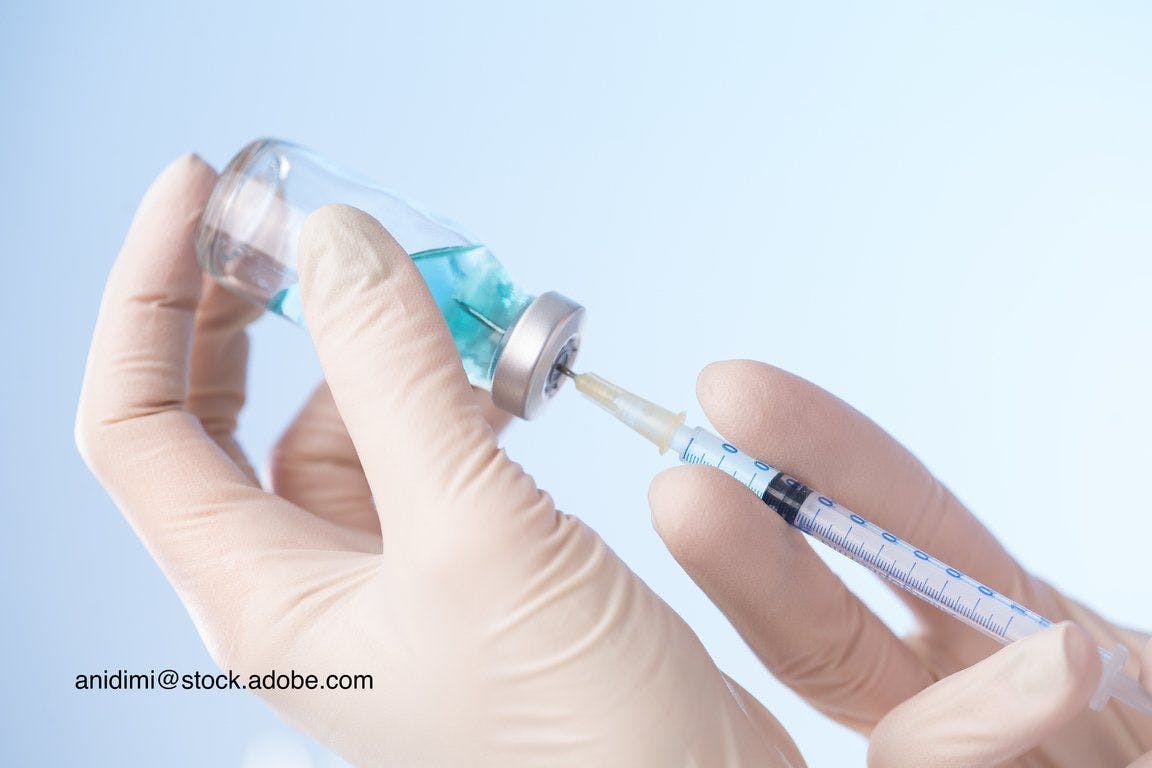 image of syringe and vaccine