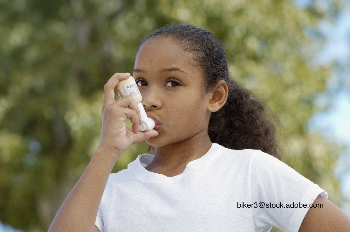 image of girl with asthma inhaler