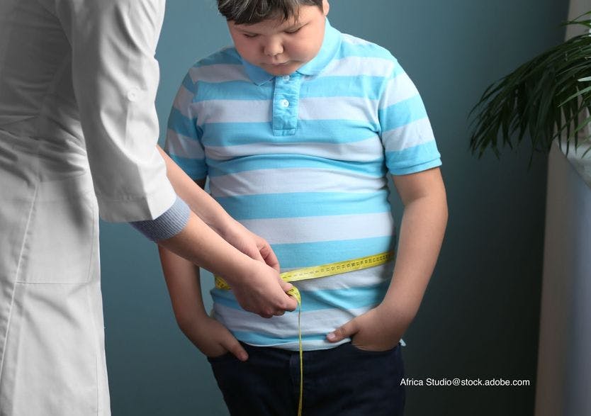 child being measure for waist circumference