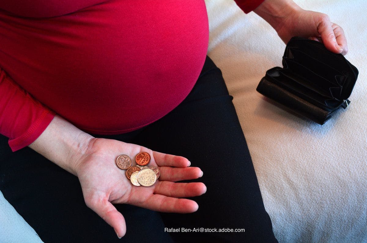 pregnant woman worrying about money