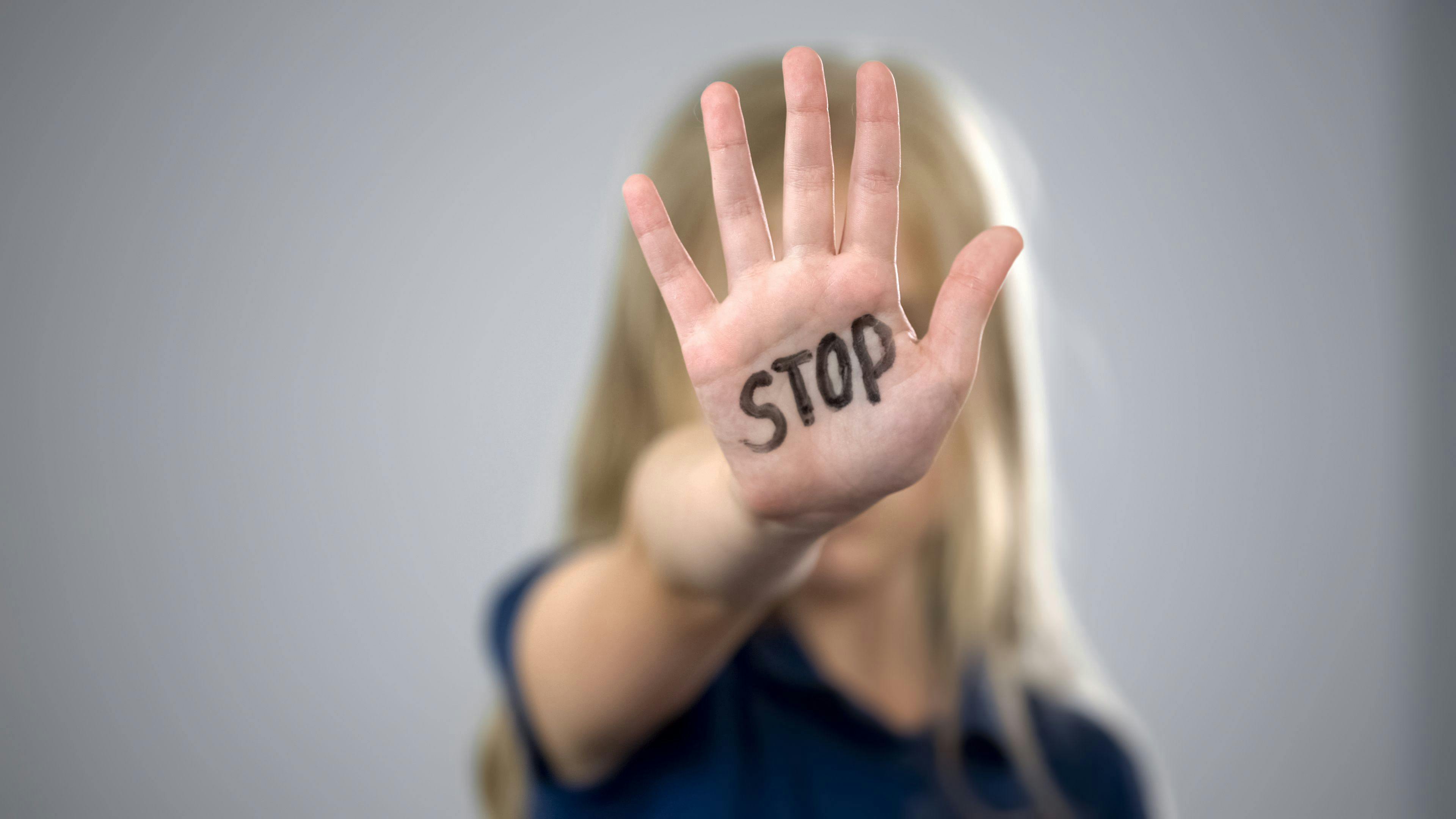 Child holding up hand with the word "STOP" | Image Credit: © motortion - © motortion - stock.adobe.com.