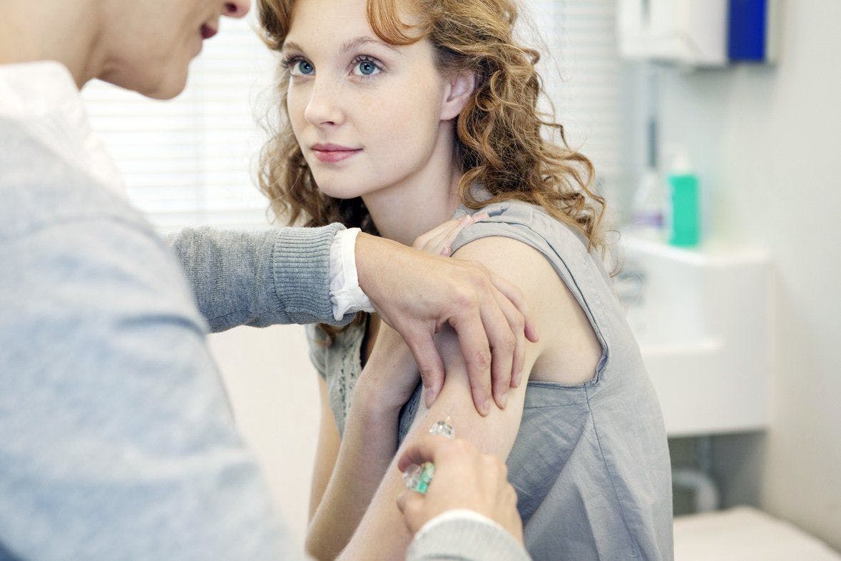 image of older teen receiving a vaccine
