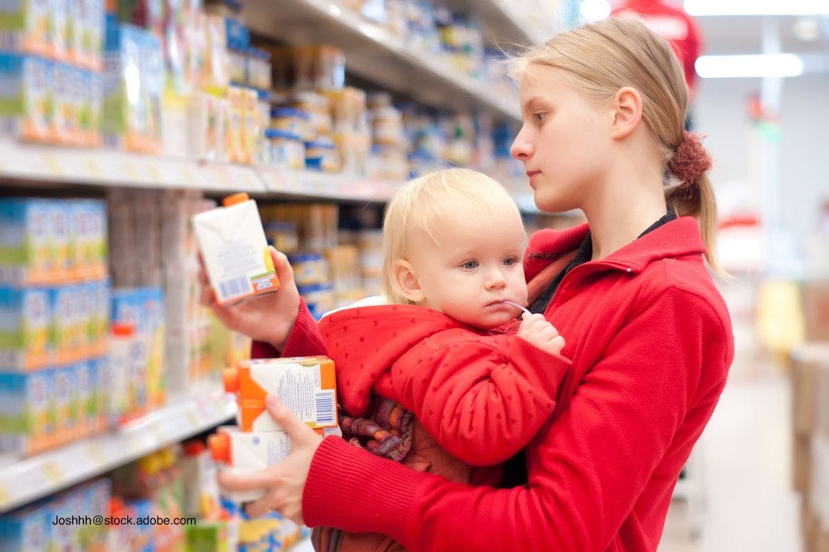 young mother and child grocery shopping